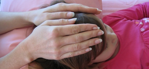 Girl receiving Reiki treatment